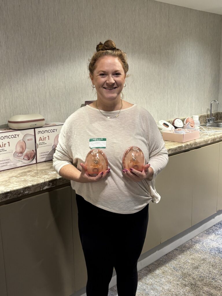 Colleen, IBCLC with Whole Women Nutrition, holding wearable breast pump cups
